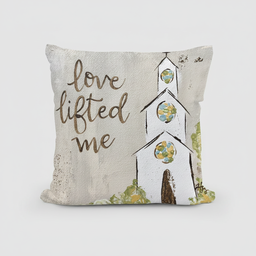 Decorative pillow with 'love lifted me' text and a church design on a beige background
