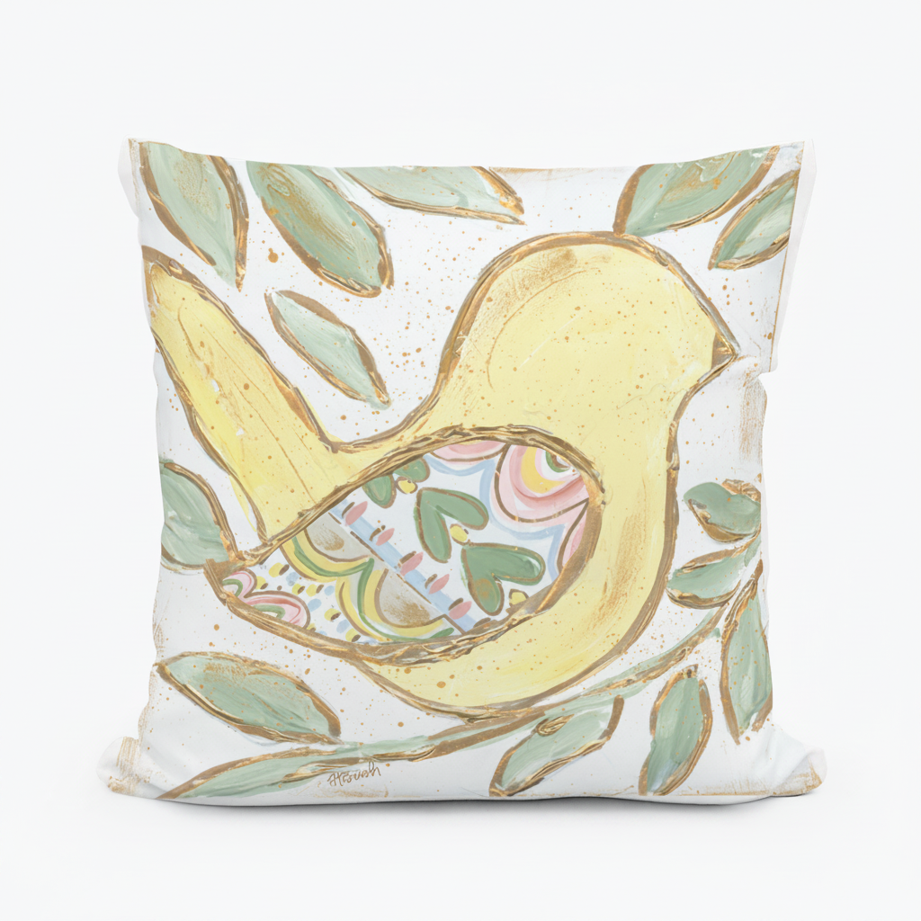 Decorative pillow with a yellow bird design on a white background