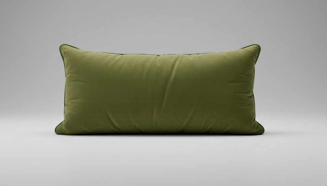 An olive green velvet lumbar pillow with a long rectangular shape and piped edges, shown against a plain white background.